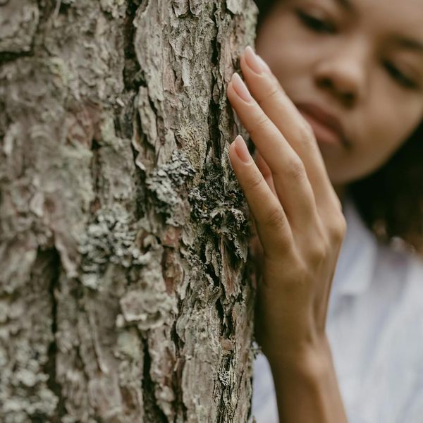 Person feeling balanced and centered in a natural setting.